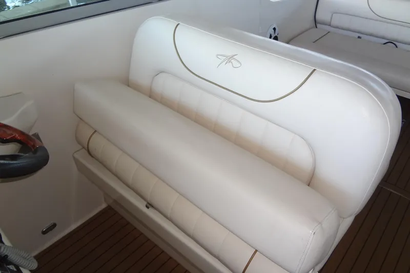 Slide: The Image of White leather seating on a 2000 Monterey 302 Cruiser boat interior. - 18