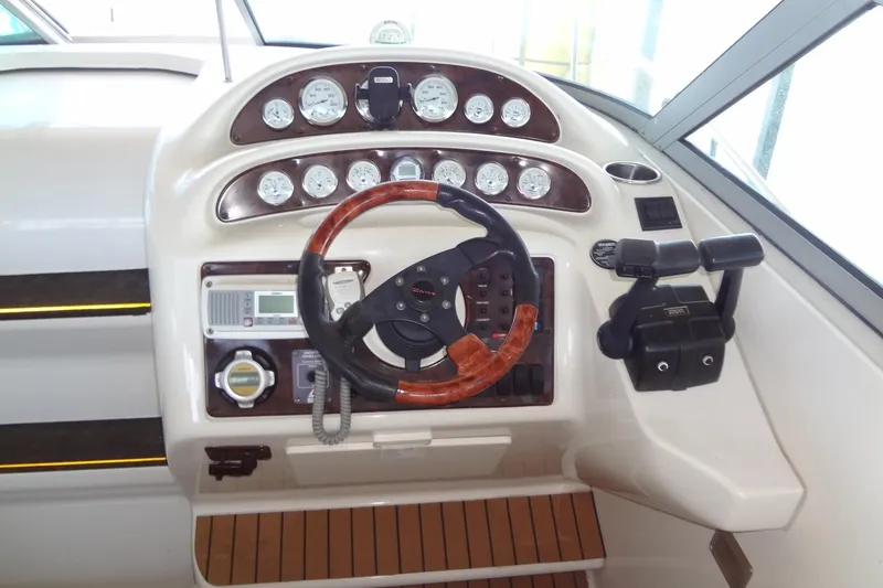 Slide: The Image of Cockpit of 2000 Monterey 302 Cruiser with steering wheel and control panel. - 19