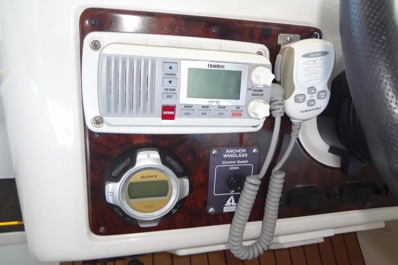 Slide: The Image of Control panel of a 2000 Monterey 302 Cruiser with radio and anchor windlass switch. - 21