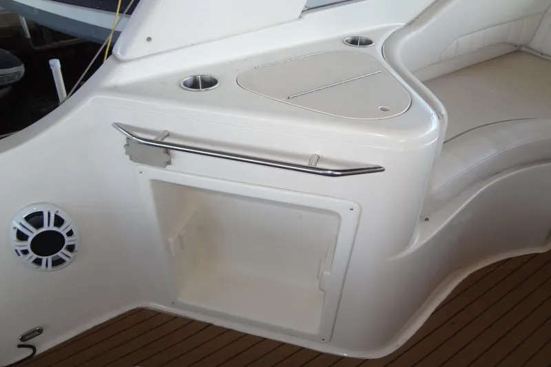 Slide: The Image of Interior of 2000 Monterey 302 Cruiser boat with seating and storage compartment. - 26