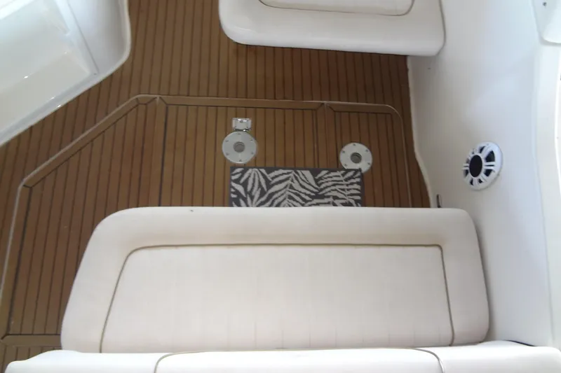 Slide: The Image of Interior of 2000 Monterey 302 Cruiser with wood flooring and cushioned seating. - 28