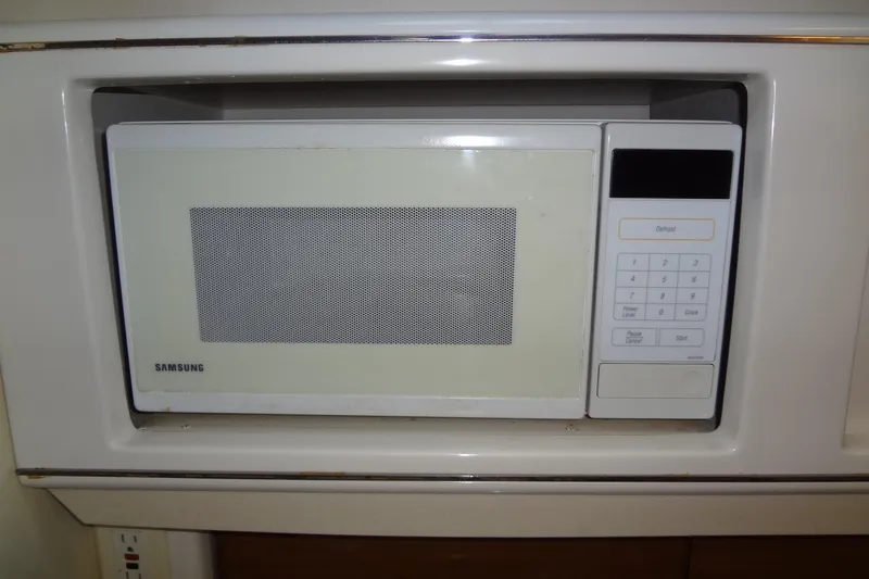 Slide: The Image of Built-in Samsung microwave in a 2000 Monterey 302 Cruiser boat kitchen. - 38