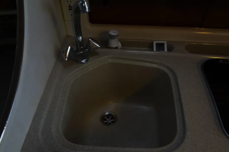 Slide: The Image of Kitchen sink and faucet in 2000 Monterey 302 Cruiser boat. - 39