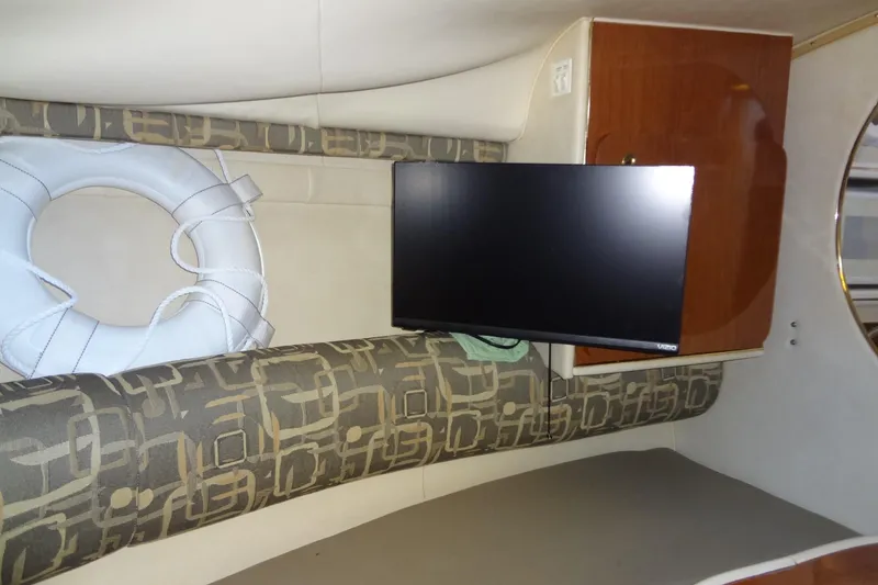 Slide: The Image of Interior of 2000 Monterey 302 Cruiser with TV and life preserver. - 42