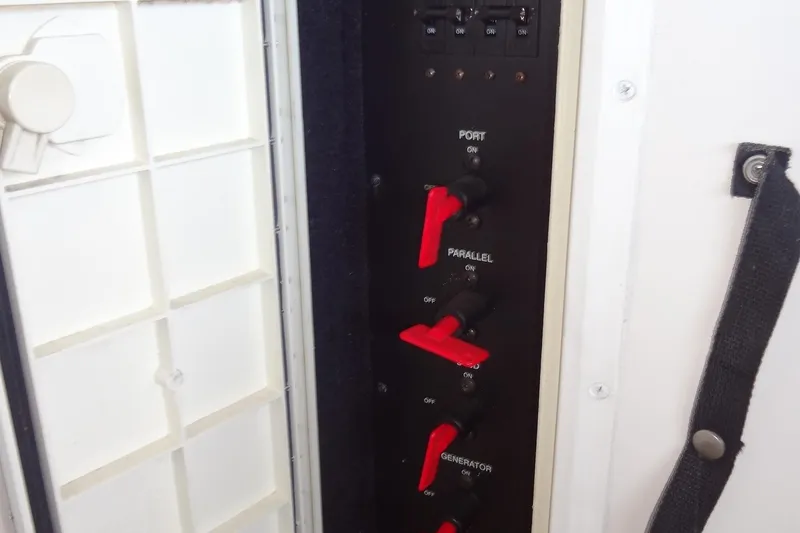 Slide: The Image of Control panel with switches on a 2000 Monterey 302 Cruiser boat. - 45