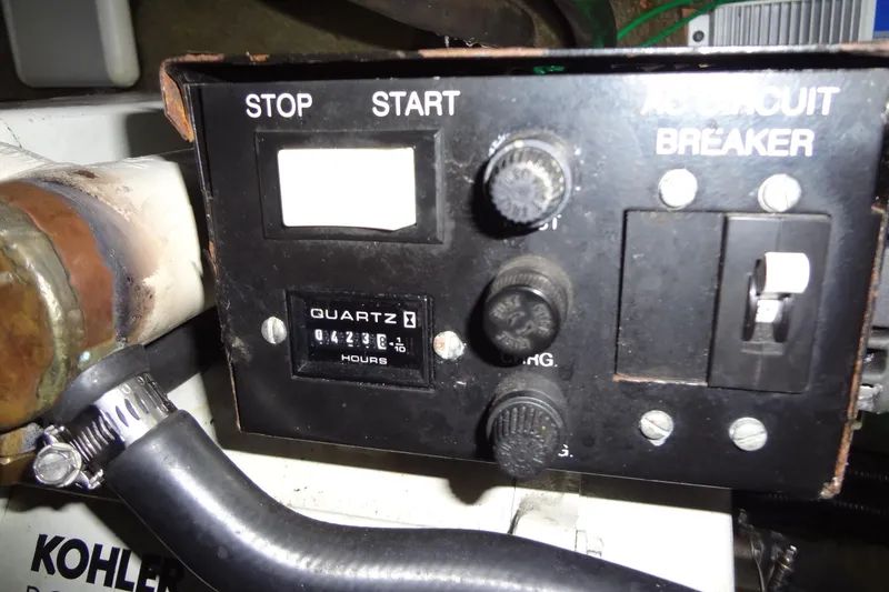 Slide: The Image of Control panel of a 2000 Monterey 302 Cruiser with hour meter and circuit breaker. - 50