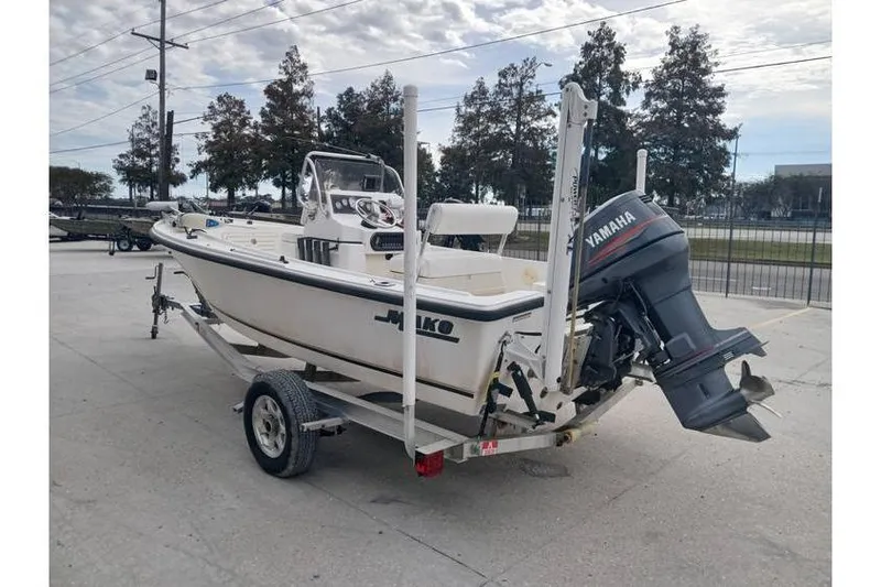 Slide: The Image of 2001 Mako 171 Center Console boat on trailer with Yamaha outboard motor. - 2