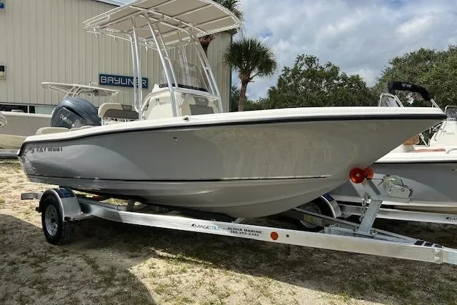 The Image of 2026 Key West 189 FS boat on trailer, parked outdoors near palm trees. - 0