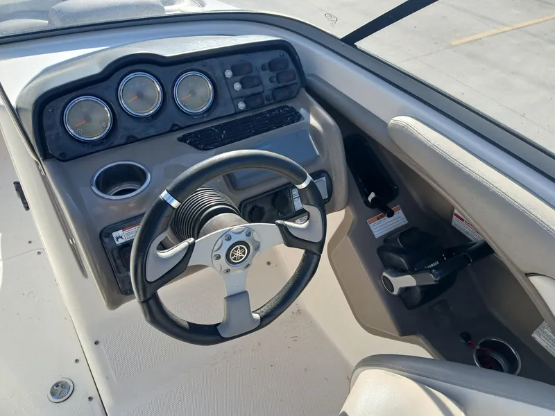 Slide: The Image of 2010 Yamaha Boats 242 Limited on trailer, sleek design, outdoor setting. - 3