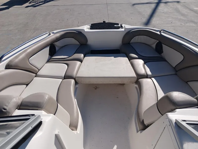 Slide: The Image of 2010 Yamaha Boats 242 Limited on trailer, parked outdoors under a canopy. - 4