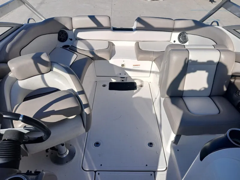Slide: The Image of 2010 Yamaha Boats 242 Limited interior with steering wheel and seating. - 7
