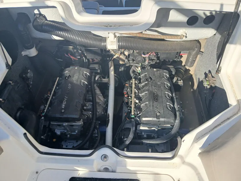 Slide: The Image of 2010 Yamaha Boats 242 Limited interior with seating and steering wheel. - 9