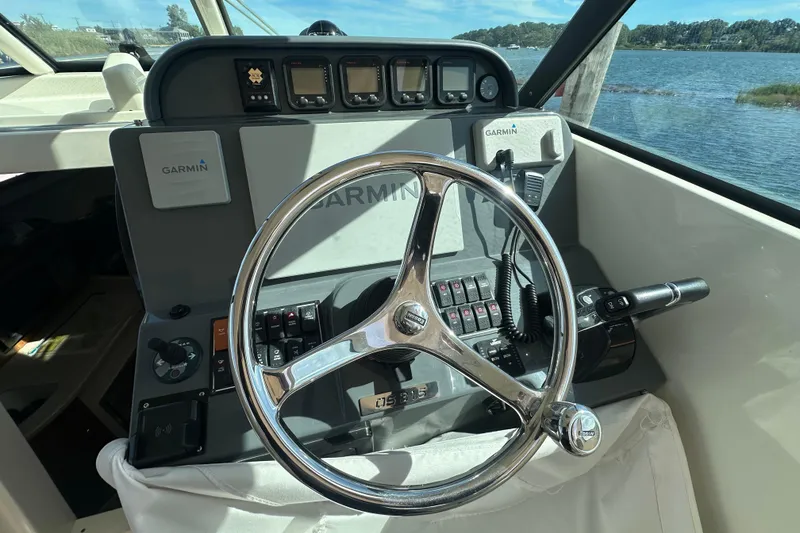 Slide: The Image of Helm of 2010 Pursuit OS 315 Offshore boat with Garmin navigation system. - 13
