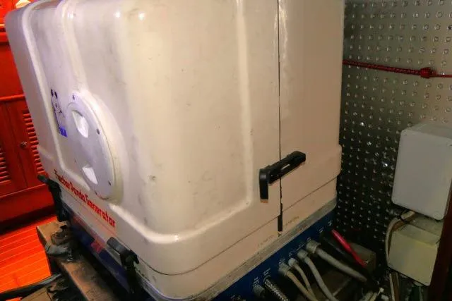 Slide: The Image of Engine compartment of 2002 Tayana 460 Vancouver Pilothouse yacht with equipment and wiring. - 100