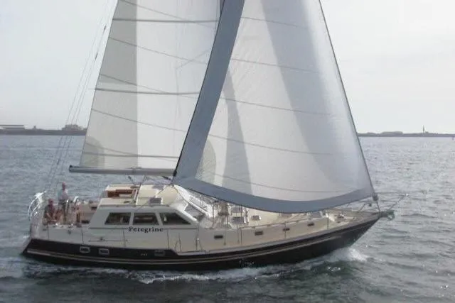 Slide: The Image of 2002 Tayana 460 Vancouver Pilothouse sailing on open water, showcasing elegant design. - 108