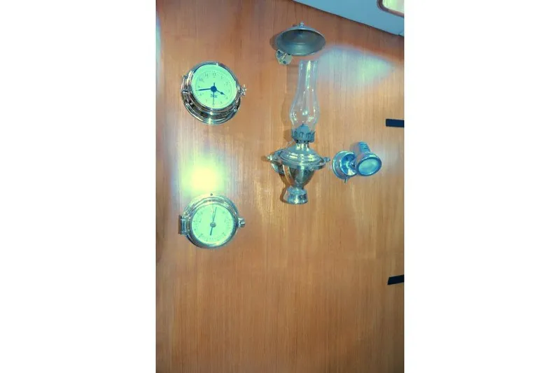 Slide: The Image of Wall-mounted nautical instruments and lamp on Tayana 460 Vancouver Pilothouse, 2002 model. - 20