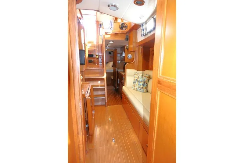 Slide: The Image of Interior of 2002 Tayana 460 Vancouver Pilothouse with wooden finish and cozy seating. - 22