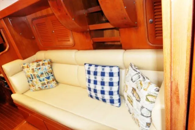 Slide: The Image of Luxurious interior of 2002 Tayana 460 Vancouver Pilothouse with comfortable seating and decorative pillows. - 24