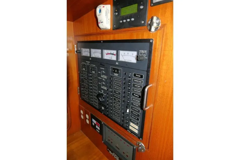 Slide: The Image of Electrical panel of 2002 Tayana 460 Vancouver Pilothouse yacht with gauges and switches. - 27