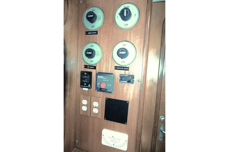 Slide: The Image of Control panel of 2002 Tayana 460 Vancouver Pilothouse yacht with switches and gauges. - 29
