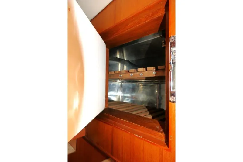 Slide: The Image of Interior view of a 2002 Tayana 460 Vancouver Pilothouse wooden cabinet. - 34