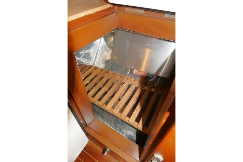Slide: The Image of Wooden storage compartment in 2002 Tayana 460 Vancouver Pilothouse yacht interior. - 35