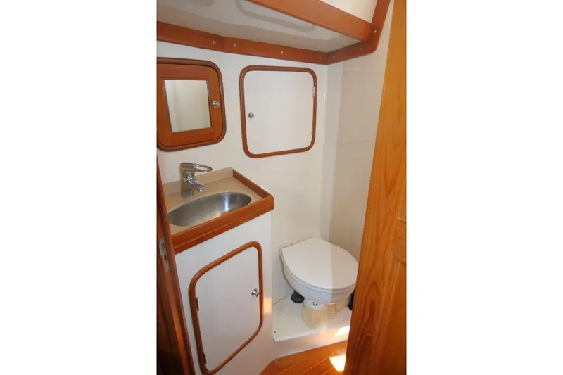 Slide: The Image of Compact bathroom in 2002 Tayana 460 Vancouver Pilothouse with sink and toilet. - 54