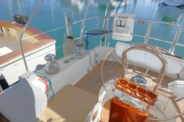 Slide: The Image of 2002 Tayana 460 Vancouver Pilothouse yacht cockpit with steering wheel and winches. - 60