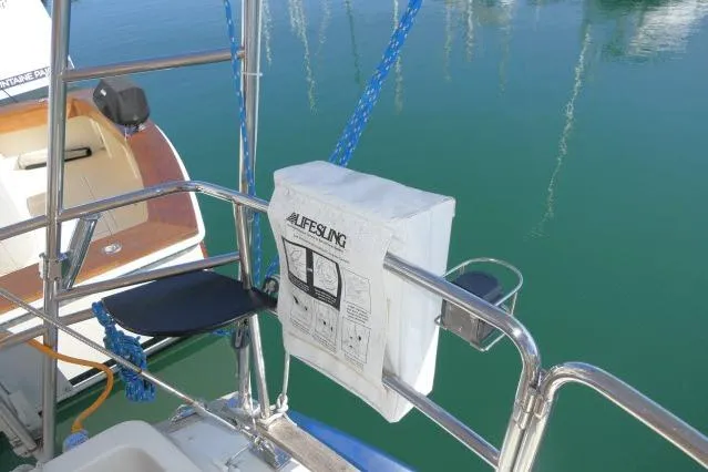 Slide: The Image of Lifesling on 2002 Tayana 460 Vancouver Pilothouse yacht, docked with calm water reflection. - 61