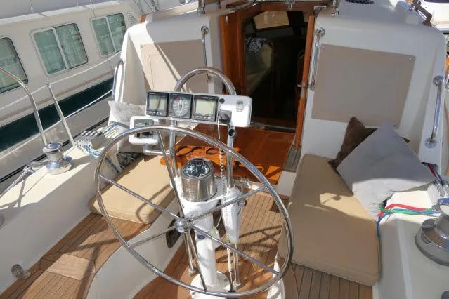 Slide: The Image of Pilothouse of 2002 Tayana 460 Vancouver yacht with steering wheel and navigation instruments. - 63