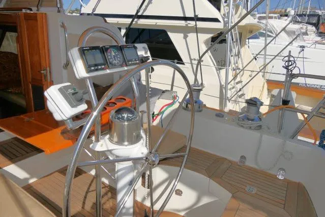 Slide: The Image of Pilothouse of 2002 Tayana 460 Vancouver yacht with steering wheel and navigation instruments. - 64