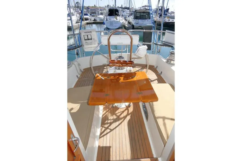 Slide: The Image of Pilothouse of 2002 Tayana 460 Vancouver yacht with wooden table and steering wheel. - 68