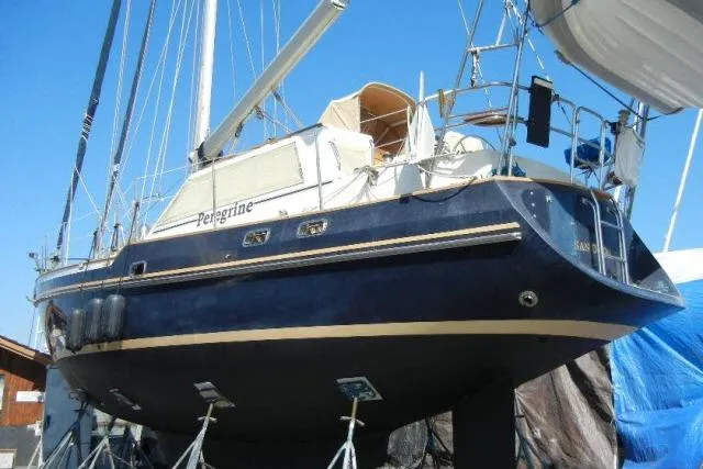 Slide: The Image of 2002 Tayana 460 Vancouver Pilothouse sailboat on dry dock, blue hull, sunny day. - 90