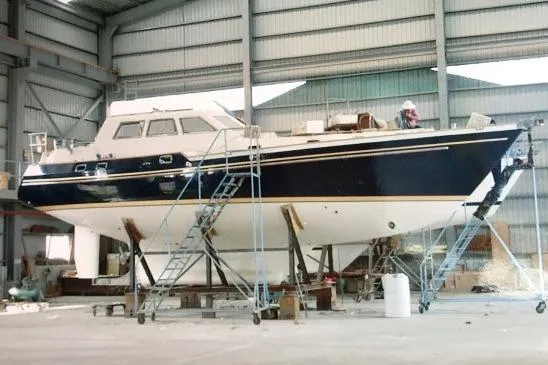 Slide: The Image of 2002 Tayana 460 Vancouver Pilothouse yacht in a shipyard under maintenance. - 93