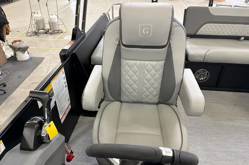 Slide: The Image of Captain's chair on 2026 Godfrey Sweetwater 22' Tritoon, featuring luxurious upholstery and modern design. - 11