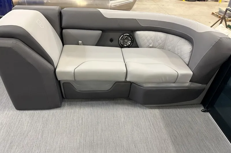 Slide: The Image of 2026 Godfrey Sweetwater 22' Tritoon lounge seat with gray upholstery and speaker. - 4