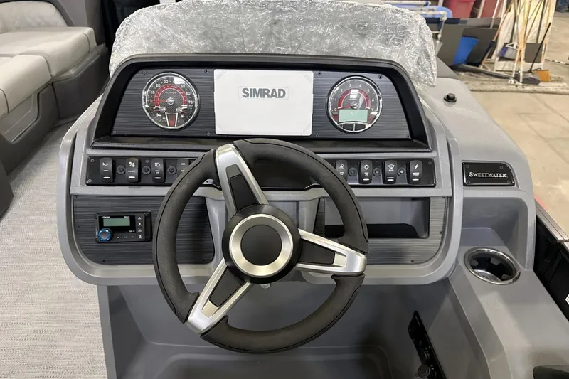 Slide: The Image of Steering console of 2026 Godfrey Sweetwater 22' Tritoon with Simrad display and controls. - 9