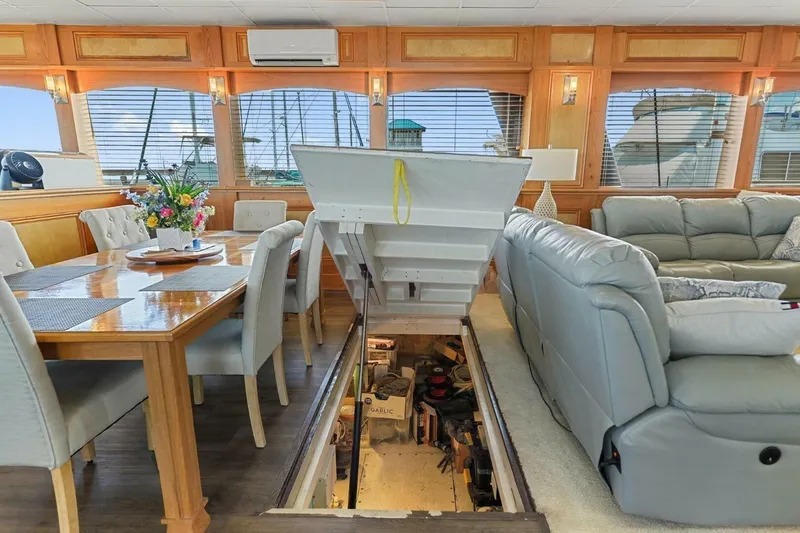 Slide: The Image of Luxurious interior of 2018 Avenger Custom Catamaran with dining area and hidden storage. - 11