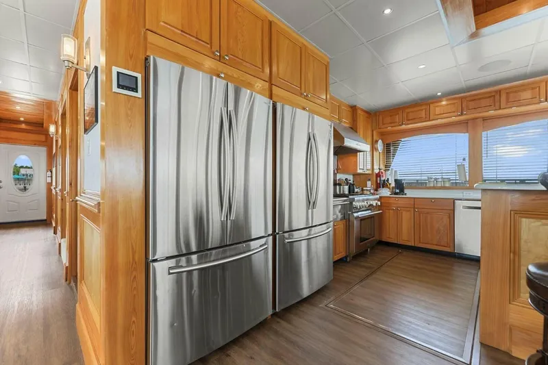 Slide: The Image of Luxurious kitchen interior of 2018 Avenger Custom Luxury Catamaran Coastal Cruiser with stainless steel appliances. - 17
