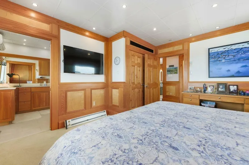 Slide: The Image of Luxurious bedroom interior on 2018 Avenger Custom Luxury Catamaran Coastal Cruiser with wood paneling. - 22
