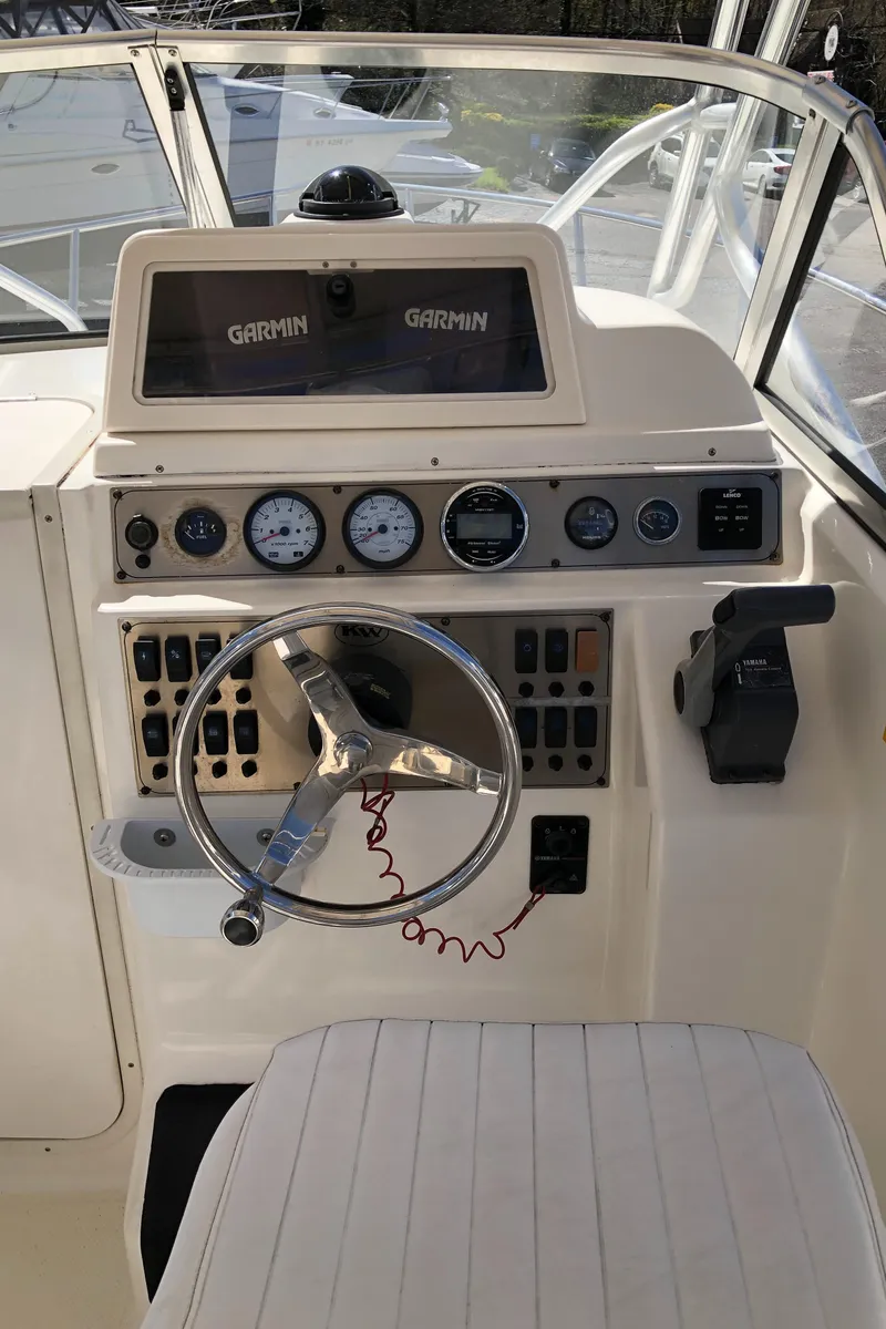 Slide: The Image of 2008 Key West 2300 Walkaround boat dashboard with Garmin navigation system. - 9