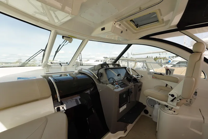 Slide: The Image of Interior of 2015 Pursuit OS 385 Offshore boat with modern helm and seating. - 20