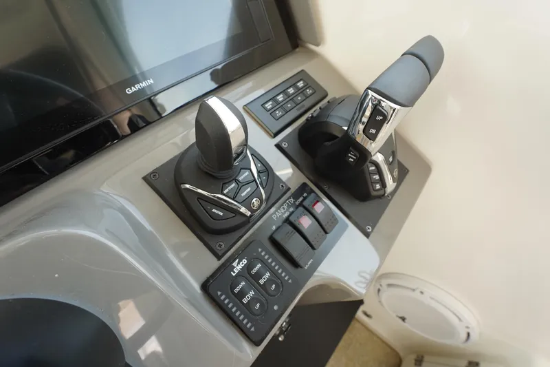 Slide: The Image of Control panel of 2015 Pursuit OS 385 Offshore boat with Garmin display and joystick. - 30