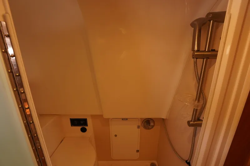 Slide: The Image of 2015 Pursuit OS 385 Offshore bathroom with shower and toilet. - 54