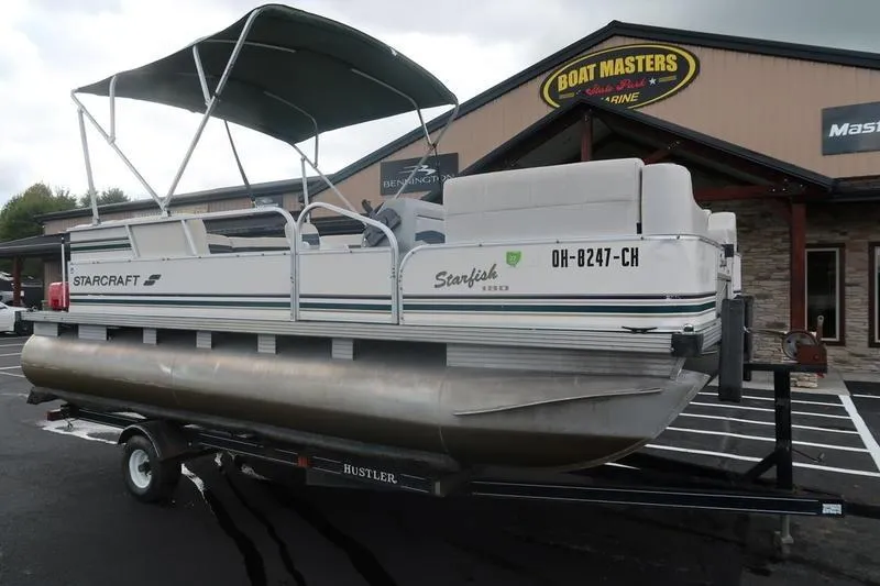 The Image of 1999 Starcraft Starfish 180 pontoon boat on trailer at Boat Masters Marine. - 1