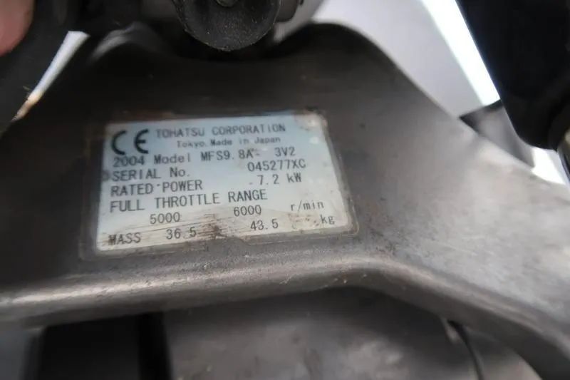 Slide: The Image of Tohatsu outboard motor label, model MFS9.8A, 7.2 kW, full throttle range 5000-6000 rpm. - 3
