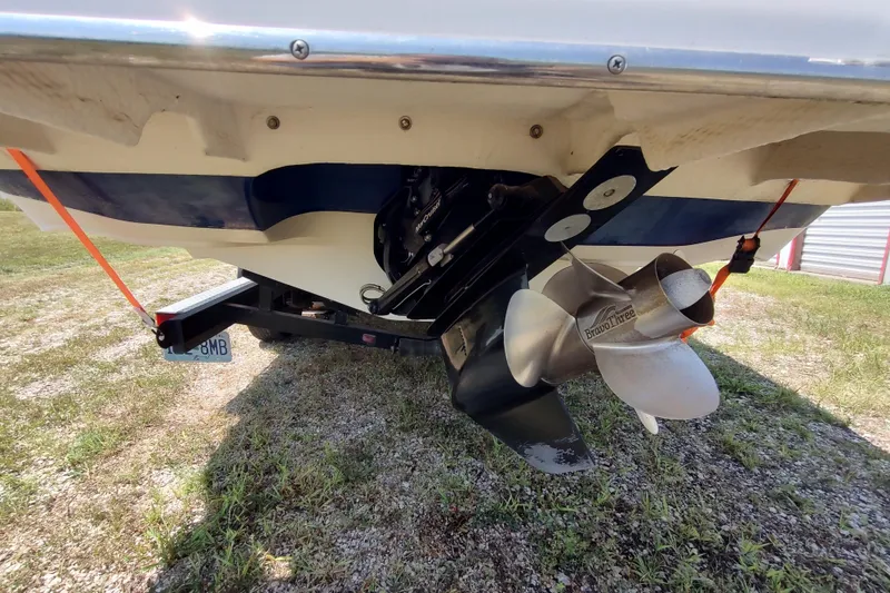 Slide: The Image of 2005 Rinker 232 Captiva Cuddy boat stern with Bravo Three propeller on trailer. - 3