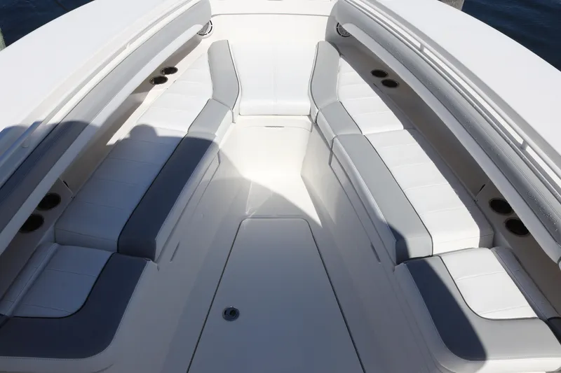 Slide: The Image of 2020 Regulator 31 boat interior with white and gray seating arrangement. - 21
