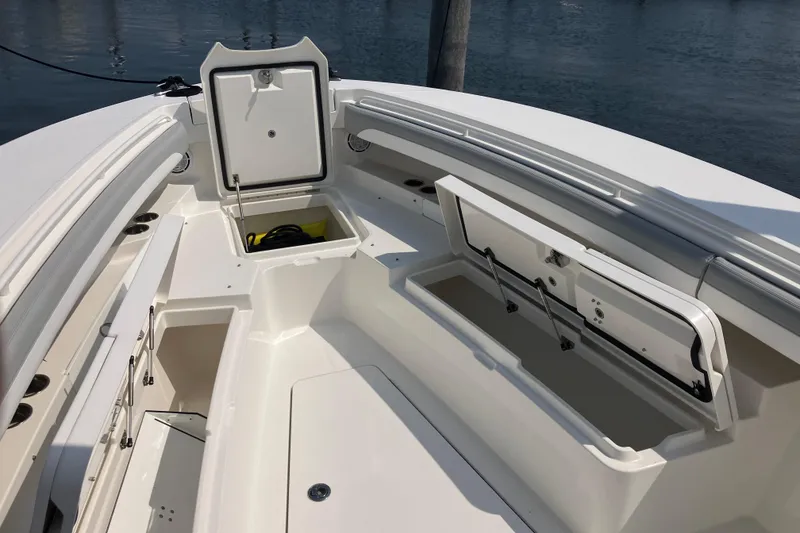 Slide: The Image of 2020 Regulator 31 boat interior with open storage compartments and sleek design. - 22
