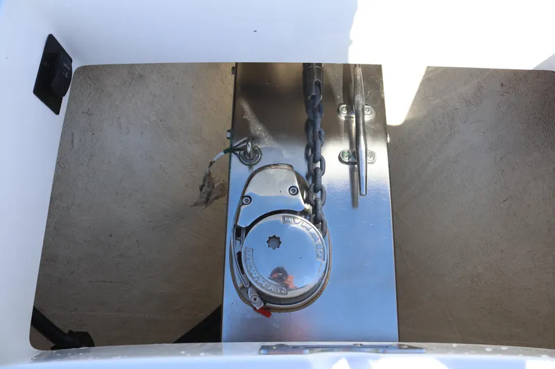 Slide: The Image of Anchor chain mechanism on a 2020 Regulator 31 boat, featuring a Lewmar windlass. - 23